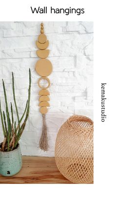 terracotta ceramic wall hanging with hemp tassel put together using natural hemp ropehanging against a white wall Earthy Wall Art, Clay Moon, Hygge Style, Terracotta Wall