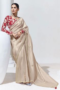 Step into timeless sophistication with our Ethereal Elegance: Designer Organza Saree with Satin Silk Blouse. The saree, crafted from delicate Organza, drapes beautifully for an ethereal look. Paired with a luxurious Satin Silk blouse, this ensemble perfectly blends grace and style. Care Instructions: Dry clean for the first wash. Slight color variations may occur. Classic Saree, Sequins Blouse, Grey Saree, Party Sarees, Embroidery Saree, Grey Blouse, Cream Silk, Organza Saree, Organza Fabric