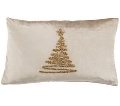 a white pillow with a gold christmas tree on it