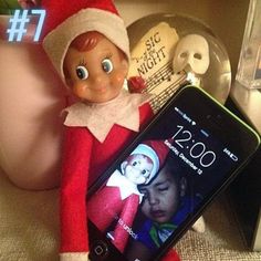 an elf with a cell phone next to it