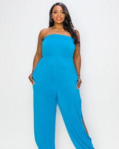 This strapless jumpsuit adds pizzazz to your casual wear wardrobe, the full legs have slits on the sides and finish with a ribbed cuff. Wear this stretchy jumpsuit for a night out, poolside party, and even as a beachy coverup. Perfect for the summer, this strapless plus-size jumpsuit can be worn with heels for a night out, or flip-flops to the beach. L I V D Lillian Sleeveless Jumpsuit | Turquoise | Dresses | Materials & Care Instructions: ['95% Polyester, 5% Spandex', 'Machine wash cold', 'Made Trendy Blue Strapless Jumpsuits And Rompers, Spring Strapless Jumpsuit For Loungewear, Strapless Jumpsuits And Rompers For Summer Loungewear, Summer Strapless Stretch Jumpsuit For Loungewear, Comfortable Strapless Jumpsuit For Summer Loungewear, Summer Stretch Strapless Jumpsuit For Loungewear, Chic Strapless Jumpsuit For Loungewear, Blue Stretch Strapless Jumpsuit For Summer, Blue Strapless Stretch Jumpsuit For Summer