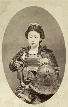 an old photo of a woman with a helmet on her head and holding a large object