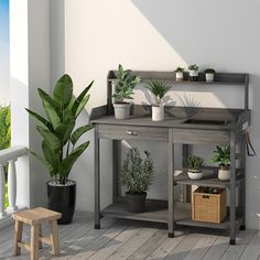 a potted plant sitting on top of a table next to a wooden bench and chair