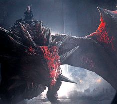 a man riding on the back of a giant red dragon in a dark place with fog