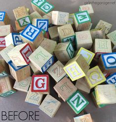 a pile of wooden blocks with letters and numbers on them