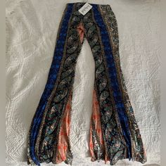 Size Small Blue Bottoms For Fall Festival, Trendy Blue Pants For Festival, Trendy Blue Festival Pants, Bohemian Blue Pants For Fall, Bohemian Orange Bottoms For Fall, Multicolor Festival Pants For Fall, Stretch Blue Bottoms For Festival, Bohemian Stretch Multicolor Bottoms, Orange Stretch Bottoms For Festival