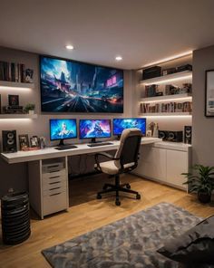 a home office with three computer screens on the wall and two desks in front of it