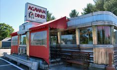 an old diner sits empty in a parking lot