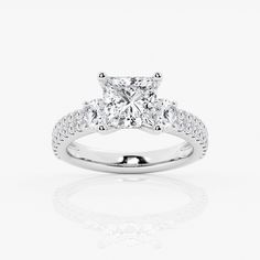 a princess cut diamond engagement ring with pave set shoulders