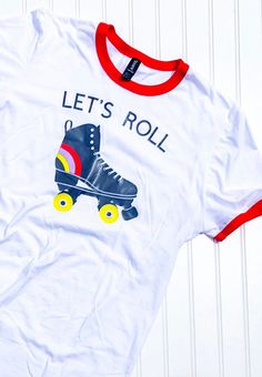 a t - shirt that says let's roll with roller skates on it