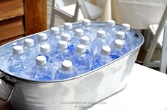 a bucket filled with water sitting on top of a table