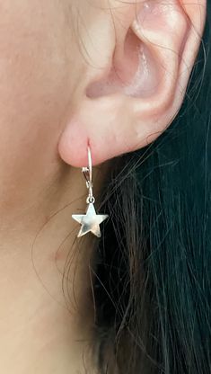 These silver star earrings are the perfect addition to any outfit! They can be great for everyday wear or for a occasion. I love these because they complete my look and add a extra pop to my outfit. I wear them to work, out, run errands and more. Seriously, you can't go wrong with these!! Any of your outfits need some shining through? These are calling your name! This listing is for one pair (1) of mini silver star charm earrings For extra protection of these earrings: - Please avoid contact with moisture for all jewelry. Apply lotions, sprays and perfumes before putting on jewelry. Take off jewelry before exercise and bed. Keeping your jewelry as dry as possible will help prolong the nature of its color and shine. - Store your jewelry when dry only. To clean jewelry, gently use a soft clo Elegant Star-shaped Nickel-free Hoop Earrings, Everyday Star Shaped Pierced Earrings, Elegant Star Shaped Nickel-free Hoop Earrings, Dainty Star-shaped Hoop Earrings For Everyday, Silver Star-shaped Sterling Silver Hoop Earrings, Minimalist Star Shaped Ear Wire Jewelry, Minimalist Star-shaped Ear Wire Jewelry, Minimalist Star-shaped Jewelry With Ear Wire, Small Hoop Sterling Silver Earrings With Star Charm