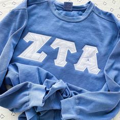 This trendy, unique, handcrafted Silver Glitter Marble Comfort Colors Greek Letter Crewneck Sweatshirt is sure to stand out on any campus! Grab one for you, your big/little, or a group of sisters (bulk discount information can be found below). If you need some greek letter shirt inspiration, please visit the inspiration page! Picture Details Pictures: ⭑ #1-2: Crimson sweatshirt, White background fabric & Blue Jean sweatshirt, White background fabric ⭑ #3: Crimson sweatshirt, White background fab Blue Varsity Top With Letter Embroidery, School Spirit Crew Neck Top With Letter Embroidery, School Spirit Crew Top With Embroidered Graphics, Collegiate Crew Neck Top With Letter Embroidery, Sorority Long Sleeve Tops For College, Sorority Long Sleeve Relaxed Fit Tops, Long Sleeve Tops For College Sororities, Sorority Crew Neck Tops For Fall, Sorority Style Letter Print Tops For Fall