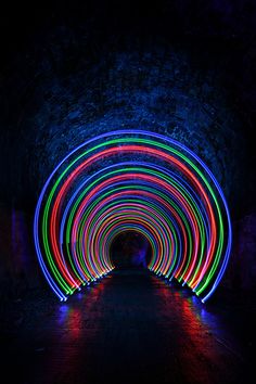 a tunnel filled with lots of colorful lights