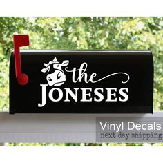 a black mailbox with the word'the joness'painted on it