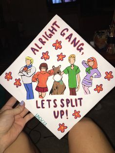 someone holding up a graduation cap that says, alright gang let's split up