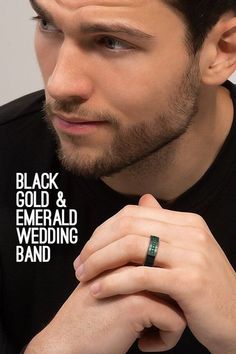 a man wearing a black and emerald wedding band with the words black gold & emerald wedding band