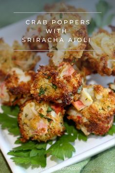 crab poppers with sriraca aioli on a white plate and green leafy garnish