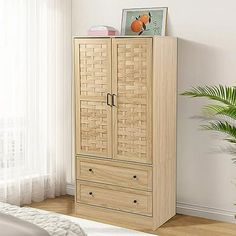 a tall wooden cabinet with drawers in a bedroom