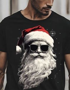 Transform your holiday wardrobe with our Cool Santa Face with Sunglasses T-shirt! Embrace the festive spirit with a touch of style as Santa Claus dons trendy shades, adding a dash of cool to your Christmas attire. Here at Gee And GiGi Designs we proudly use Premium, High Quality Bella+Canvas shirts. These are a unisex fit shirt, are light weight, and as most agree when they first wear them, are extremely soft and super comfortable. We are sure you'll love the look and feel of these shirts as muc Santa Tshirt, Christmas Attire, Trendy Shades, Kris Kringle, Santa Face, Christmas Vibes, Holiday Wardrobe, Christmas Santa, Jersey Shorts