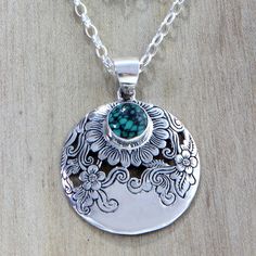 In this ravishing design from Bali's Putu Putri the artisan creates a veritable garden of blooming sunflowers. The flowers are meticulously etched onto a sterling silver pendant that is centered on a sterling cable chain. A cabochon of reconstituted turquoise centers the largest blossom..925 Sterling silver Sunflower Jewelry, Silver Jewels, Yoga Jewelry, Flower Pendant Necklace, Sterling Silver Flowers, Sterling Silver Necklace Pendants, Silver Pendants, Silver Pendant Necklace, Flower Pendant