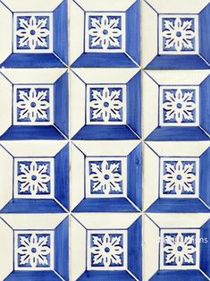 blue and white tiles with snowflakes on them