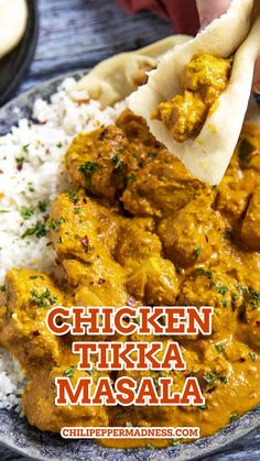 chicken tikka masala is served over rice on a plate with pita bread