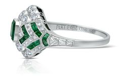 One-of-a-kind handmade Art Deco platinum ring designed using 100% natural, genuine, and conflict-free Columbian emerald gemstones and diamonds. Not treated or enhanced in any way. This ring is embedded with a center Elongated Emerald Cut and accented with square and fancy cut emeralds, and brilliant round cut diamonds. Unique and Stunning! Each ring is independently certified and appraised by GIA-trained gemologists. Model Number: SDL950WY Art Deco Emerald Ring With Platinum, Art Deco Emerald Ring With Round Cut In Platinum, Art Deco Emerald Ring With Prong Setting In Platinum, Art Deco Platinum Emerald Ring With Prong Setting, Art Deco Emerald Ring With Diamond Center Stone, Green Emerald Ring With Diamond Accents In Platinum, Platinum Emerald Ring With Diamond Accents, Anniversary Platinum Emerald Ring With Center Stone, Platinum Emerald Ring With Center Stone For Anniversary