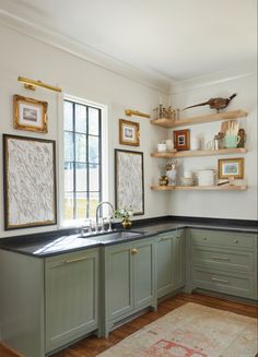 Kitchen corner with green cabinets, black mist granite countertops and floating shelves Green Cabinets, Kitchen Redo, Counter Tops