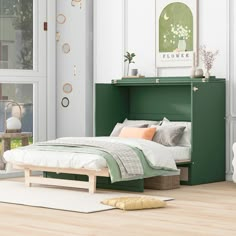 a bedroom with white walls and wood floors