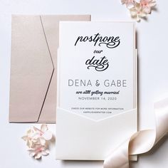 an image of wedding stationery with flowers on the side and ribbon around it that says marriage our date