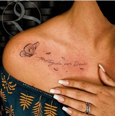 a woman's chest with a butterfly tattoo on her left shoulder and the words, butterflies