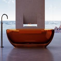 an orange bath tub sitting in front of a window