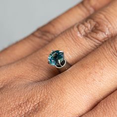 This loose stone is available for a custom ring by Anueva Jewelry. Select your stone first and then select a setting. Add both to your cart and we'll create your ring! 1.03CT ROUND NIGERIAN SAPPHIRE, TEAL BLUE GREEN, 6.02X3.83MM, UNTREATED. Totally natural/untreated with visible silk inclusions. This stone still sparkles and is a budget buy! Lovely, modern round brilliant cut. About Heat Treatments: Some colored gemstones are routinely heated for color and clarity improvement. This is a permanen Emerald Ring With Sapphire Accent Stones, Emerald Sapphire Ring With Accent Stones, Sapphire Gemstones With Prong Setting, Sapphire Gemstones In Prong Setting, Oval Apatite Gemstone Ring, Blue Emerald Ring With Round Cut, Blue Emerald Ring With Prong Setting, Oval Blue Emerald Ring, Blue Oval Emerald Ring