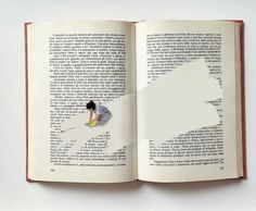 an open book with the pages cut out to look like a person kneeling on a floor