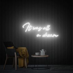 there is a neon sign that says things all are dream on the wall next to a table and chair