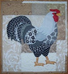 a rooster is standing in the middle of a quilt