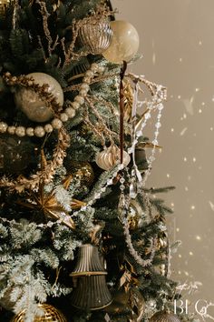 a christmas tree with ornaments and lights on it