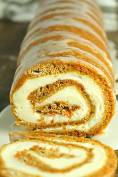 carrot roll with cream cheese filling on a white plate