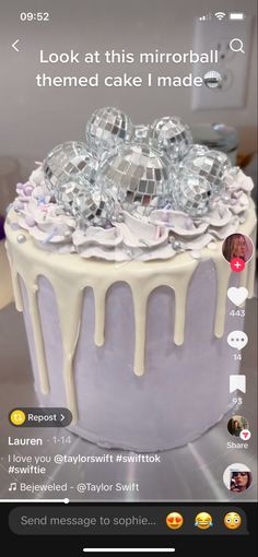 the cake is decorated with white icing and lots of candies on top of it