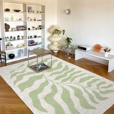 a living room filled with furniture and a large rug