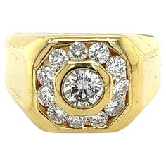 Vintage 1.50 CTTW Men's Round Cut Natural Diamond Ring. Crafted in 18K solid yellow gold. Featuring a bezel-set center stone and a channel-set diamond halo adorning the center. The finish is polished, with smooth edges that glide smoothly on the finger during wear. All the diamonds are superbly white, with eye-clean clarity and excellent cuts. This ring is a true embodiment of timeless sophistication and masculinity. Item Details: - Type: Mens Ring - Metal: 18K Yellow Gold - Weight: 14.5 Grams - Diamond Mens Ring, Vintage Setting, Natural Diamond Ring, Smooth Edges, Mens Ring, Ring Metal, Channel Set, Diamond Halo, Solid Yellow