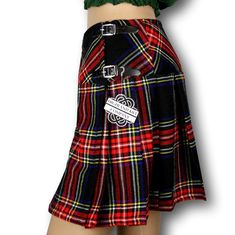 The women's tartan billie skirt is a stylish and versatile garment that combines classic Scottish heritage with contemporary fashion. Made from high-quality tartan fabric, the billie skirt showcases a beautiful array of colors and patterns, reflecting the rich tradition of Scottish plaids. The skirt features a flattering A-line silhouette that flares out from the waist, creating a feminine and elegant look. It typically falls just above or below the knee, offering a modest yet fashionable length Fitted Plaid Pleated Mini Skirt, Fitted Pleated Plaid Mini Skirt, Fitted Knee-length Plaid Bottoms, Fitted Plaid Mini Skirt, Fitted Pleated Plaid Bottoms, Scottish Plaid Skirt For Fall, Scottish Plaid Skirt For Winter, Scottish Style Plaid Skirt For Fall, Winter Scottish Plaid Skirt