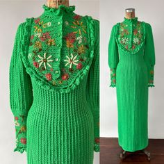 "An amazing 1970s bright green acrylic knit sweater dress that was likely crocheted by the original owner, a woman named Betty! The full length dress has a Victorian style bodice with a high, ruffled collar, and ruffled yoke, and long, puffy, lantern sleeves with fitted cuffs. It has a fitted waist as well as a long, slim, maxi length skirt. It features colorful hand embroidered flowers on the front yoke and around the sleeve cuffs, as well as knitted ruffles around the neck, yoke, and sleeve cuffs. It has a front snap closure with decorative buttons. I can't even imagine the amount of time and effort that went into making this dress! It's a wearable work of art! Brand: likely hand crocheted by the original owner Material: feels like acrylic  Size: best for XS / S Measurements: Shoulder: 1 Knitted Vintage Dress, Retro Dress 70s With Flare Sleeves, Luxury 1970s Fitted Dresses, Luxury 1970s Style Fall Dresses, 70s Winter Fashion, Knitted Ruffles, Knit Crochet Sweater, Fashion Eras, Retro Crochet