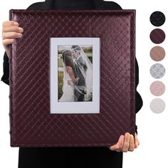 a woman holding up a photo frame with different colors