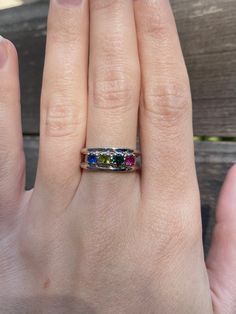 Total Weight: 3.8 grams Size: 7 Band Width: 3-6mm Sapphire: 3.75mm Emerald: 3.75mm Peridot: 3.75mm Spinel: 3.75mm Condition: In great condition showing little wear and no damage. All gold has been thoroughly checked with an Olympus RFK spectrometer. It is guaranteed 14k gold.  All our jewelry is properly washed and disinfected to ensure customers get clean items with every order.  Returns accepted but may be subjected to a restock fee.  Please message with any questions:) Green Three-stone Birthstone Ring In 14k Gold, Green Three Stone Birthstone Ring In 14k Gold, Unique Yellow Gold Ring With Birthstone, Unique Yellow Gold Birthstone Ring, Peridot Multi-stone Rings For May Birthstone, Multicolor Multi-stone Birthstone Ring For Anniversary, Multicolor Round Cut Rings With Accent Stones, Heirloom Multicolor Jewelry With Accent Stones, Sterling Silver Three Stone Green Jewelry