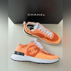 Chanel Denim Suede Calfskin Neon Orange Cc Logo Trainers Sneakers Chanel Made In Italy Cc Logo On Side Lace Up Come In Original Box With Dust Bags Material: Denim And Suede Color: Neon Orange Run True To Size 2021 Collection New Sneakers Designer Orange Sneakers, Chanel Orange, Orange Lace-up Sneakers With Red Sole, Orange Urban Lace-up Sneakers, Dynamic Orange Synthetic Sneakers, Chanel Trainers, Chanel Sneakers, Navy Chanel, Chanel #1