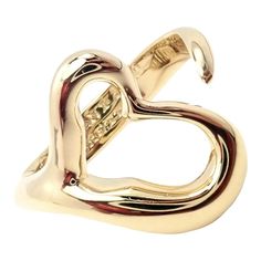 Tiffany & Co. 18k Yellow Gold Peretti Open Heart Ring, Sz 5    Metal: 18k yellow gold Ring  Size: fits up to a 5, open design  Weight 7.5g  Size 16mm At Top  Hallmarks: Tiffany & Co 750 Peretti  Dimensions reference the ring size and are not specific to the ring itself. Tiffany Gold, Sterling Silver Cz Rings, Open Heart Ring, Tiffany Rings, Vintage Designer Jewelry, 18k Yellow Gold Ring, Open Design, Open Heart, Yellow Gold Ring