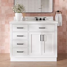 a bathroom vanity with two sinks and a large mirror over the sink in front of it