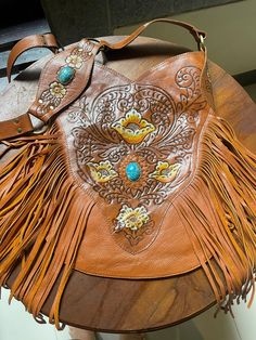 Tan fringe bag  Hand tooled  Boho style 29 cm x 34 cm. Vintage Leather Bags With Fringe, Brown Bohemian Satchel With Fringe, Brown Bohemian Fringe Satchel, Bohemian Brown Fringe Satchel, Artisan Brown Bag With Fringe, Brown Artisan Bags With Fringe, Artisan Brown Bags With Fringe, Artisan Brown Fringe Bag, Artisan Leather Shoulder Bag With Fringe